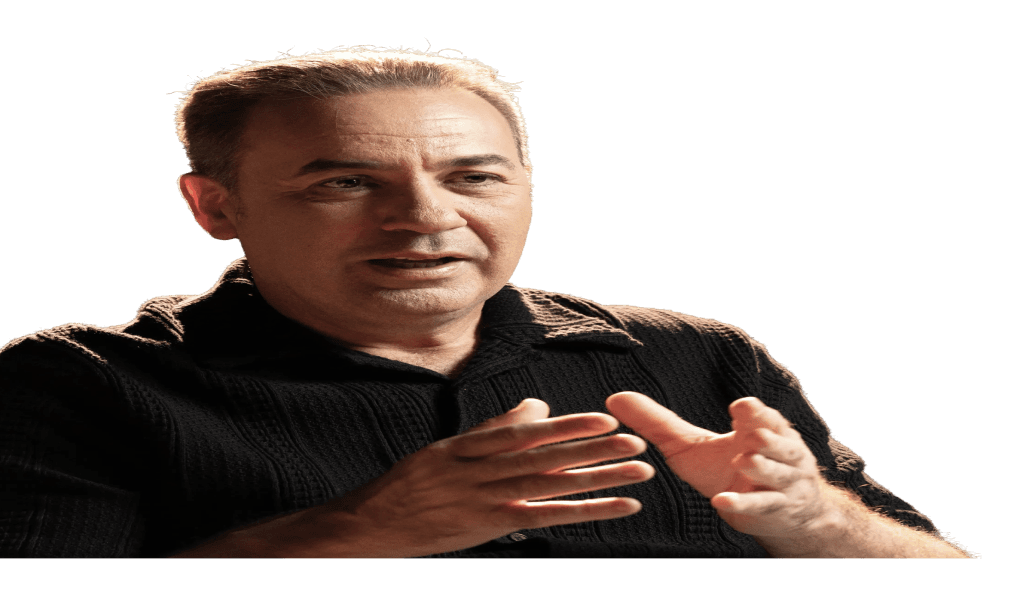 A 4:26 strategist mid-sentence, gesturing with both hands